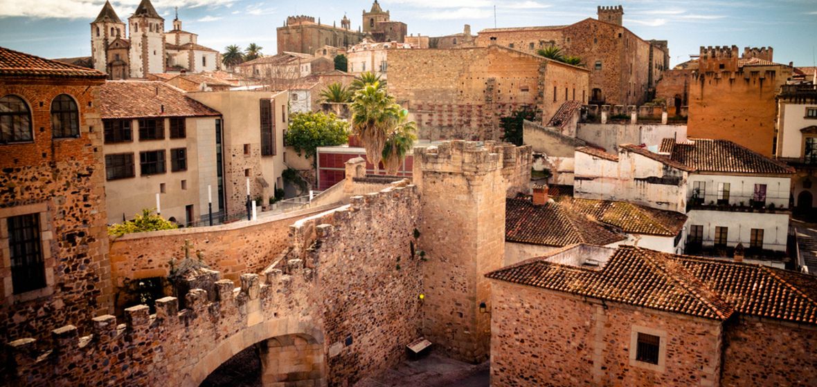 View of the medieval Old Town in Cáceres Spain with stone towers and historic buildings