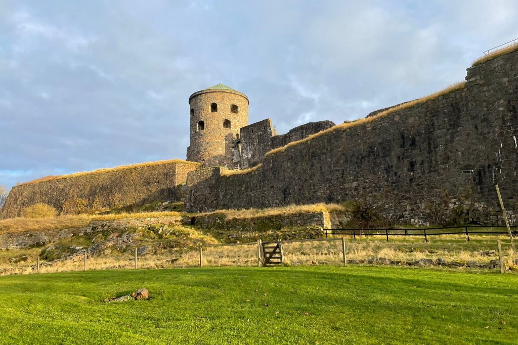 Ancient castle wall bathed in warm golden hour light