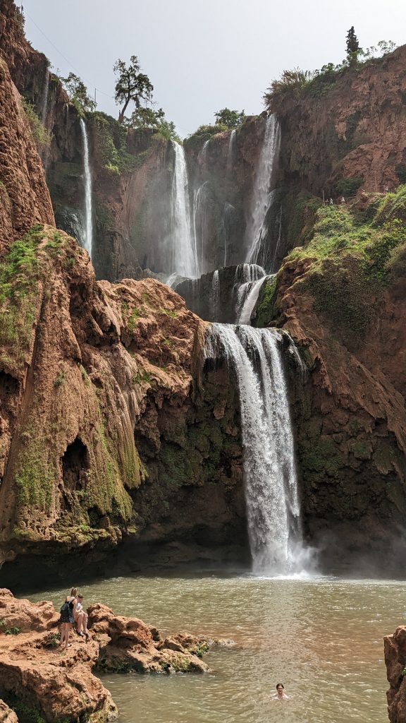 Waterfall in Morocco during Garrett Landers’ budget travel adventure, showcasing stunning natural landscapes.