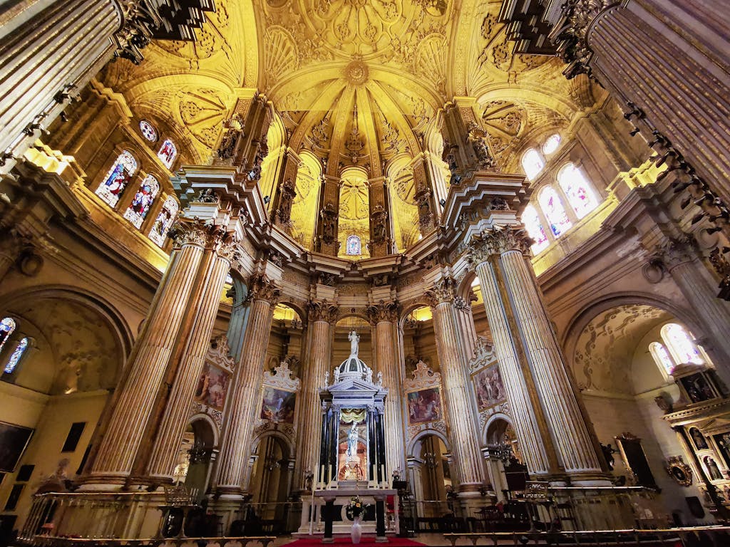 Ornate interior of Málaga Cathedral, a must-see during a weekend in Málaga on a budget, showcasing stunning architecture and rich history