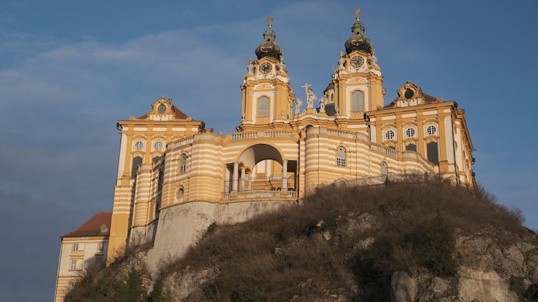 Majestic Melk Abbey perched on a cliff in Lower Austria on a Vienna to Melk day trip