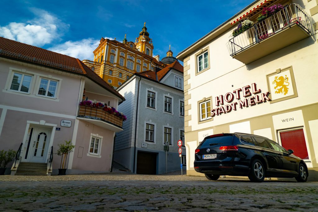 Melk Abbey rising above the pastel buildings of Melk’s old town near Hotel Stadt Melk on a sunny afternoon