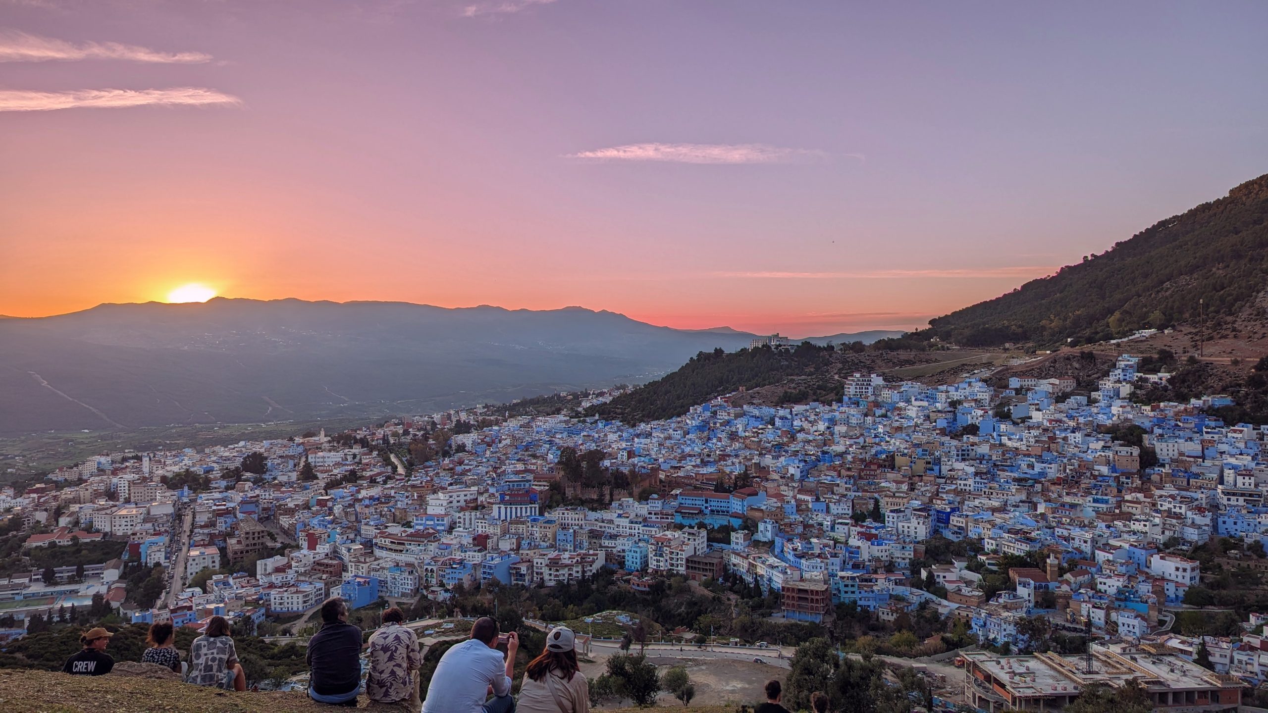 Sunset over the blue city of Chefchaouen – scenic highlight of our Morocco road trip itinerary”
