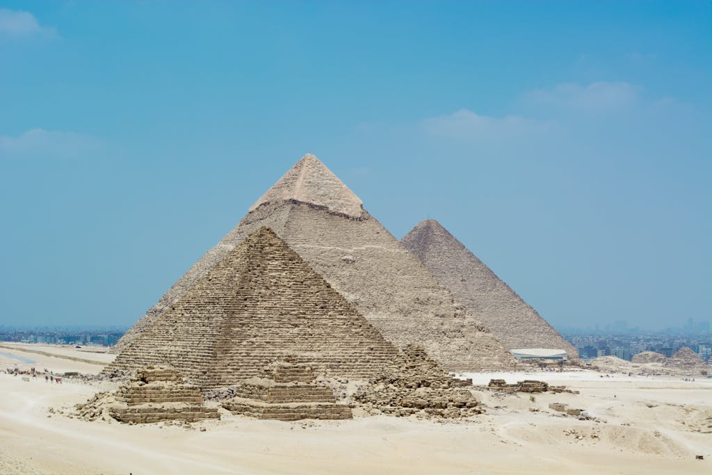 A stunning view of the Great Pyramids of Giza against a clear blue sky in Egypt.