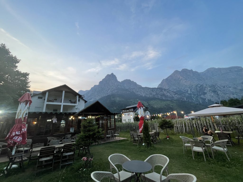 Traditional guesthouse in Valbonë, Albania, surrounded by mountains in 7 day Albania itinerary