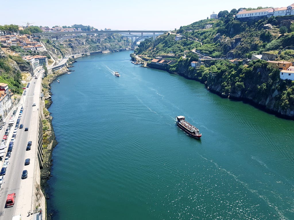 A stunning aerial view of the Douro River with the Arrábida Bridge in Porto, Portugal.