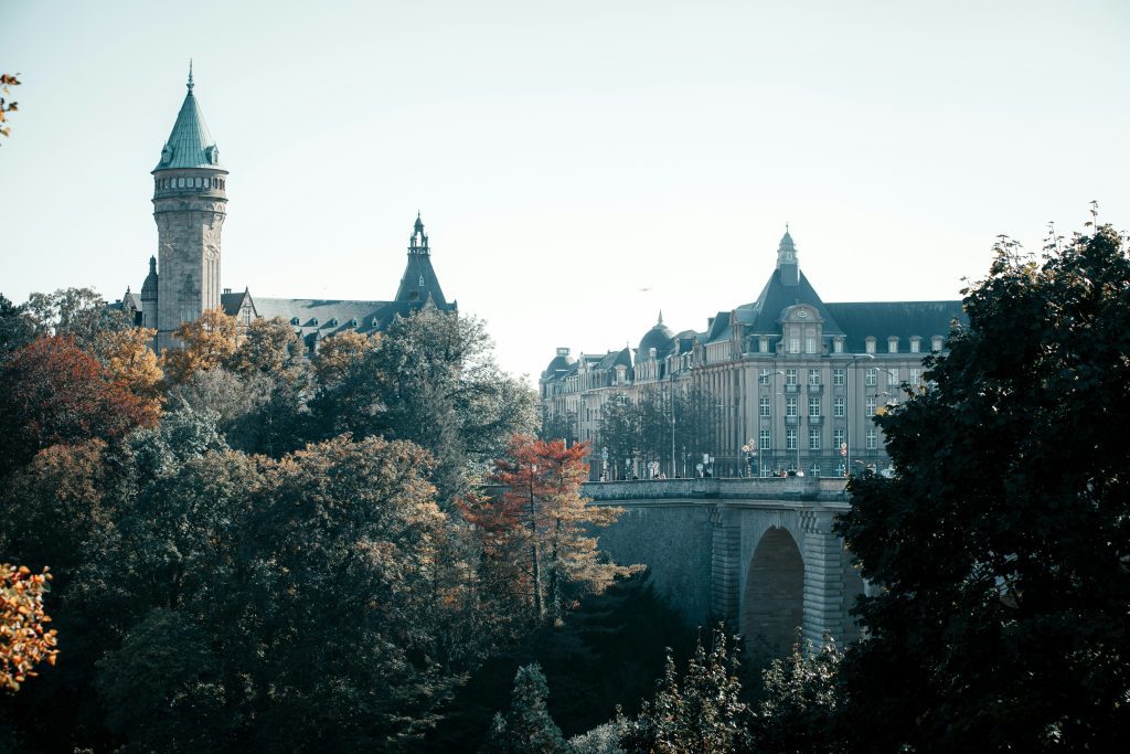 Adolphe Bridge in Luxembourg City with autumn trees and the State Savings Bank tower