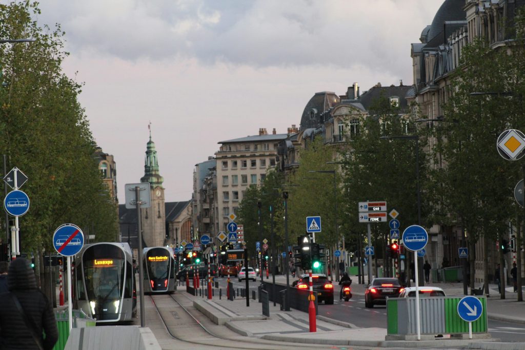 Trams and traffic on a central street in Luxembourg City near Avenue de la Liberté