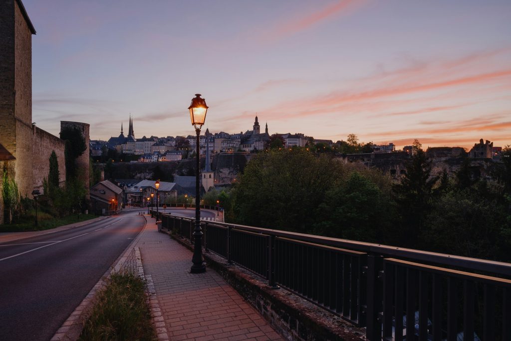 Sunset view of Luxembourg City’s upper town with old fortifications and historic skyline seen in what to visit in Luxembourg City